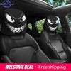 Housse décorative pour la tête de siège de voiture noire avec motif de visage de monstre effrayant installé dans un siège de 
