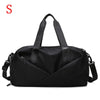 Black nylon gym and travel duffel bag with shoulder straps