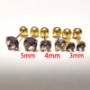 A set of gold-toned stainless steel ear stud earrings in various sizes, including 5mm, 4mm, and 3mm.