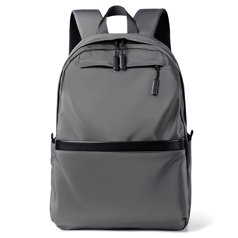 A gray men's lightweight laptop backpack shown from the front.