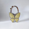Silver foldable butterfly shaped handbag hook with glitter finish