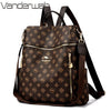 A brown genuine leather women's backpack with gold accents and a dark brown fabric pattern.