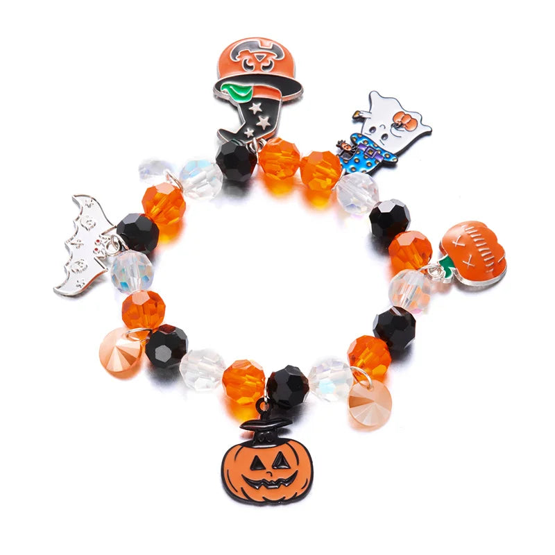 A bracelet featuring charms of a pumpkin and ghost on beaded strands.