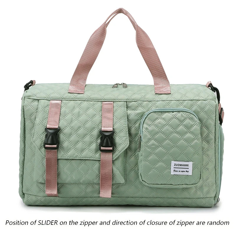 A light green nylon travel duffle bag with pink straps and a quilted pattern.