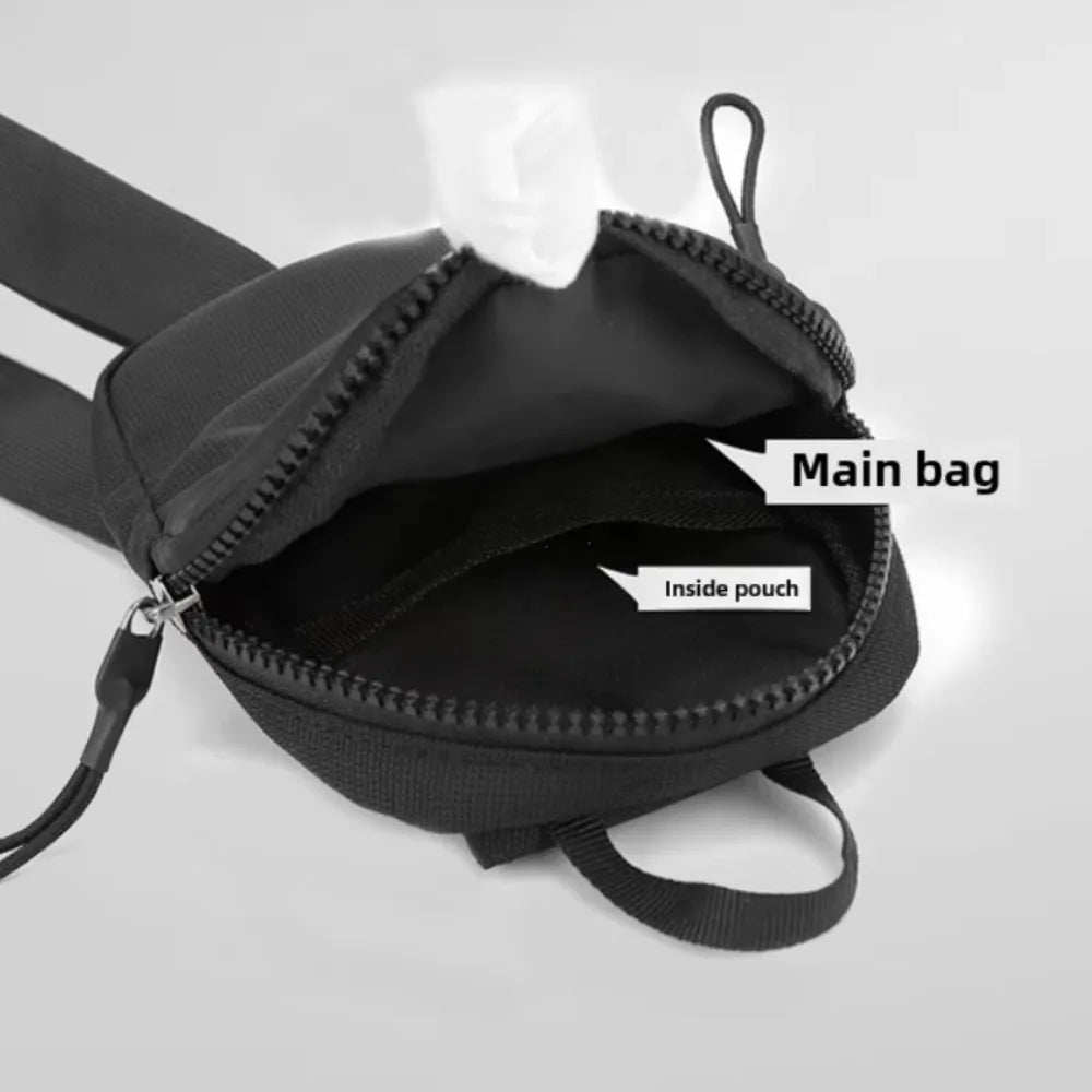 Black Oxford chest bag with an open compartment showing an inside pouch.