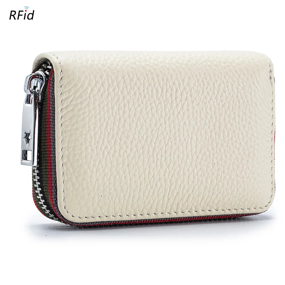 A beige genuine leather accordion card holder wallet with a silver zipper and red stitching.