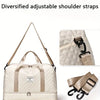 A cream-colored duffle bag with diversified adjustable shoulder straps shown in detail.