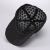 Black mesh snapback baseball cap with a floral pattern