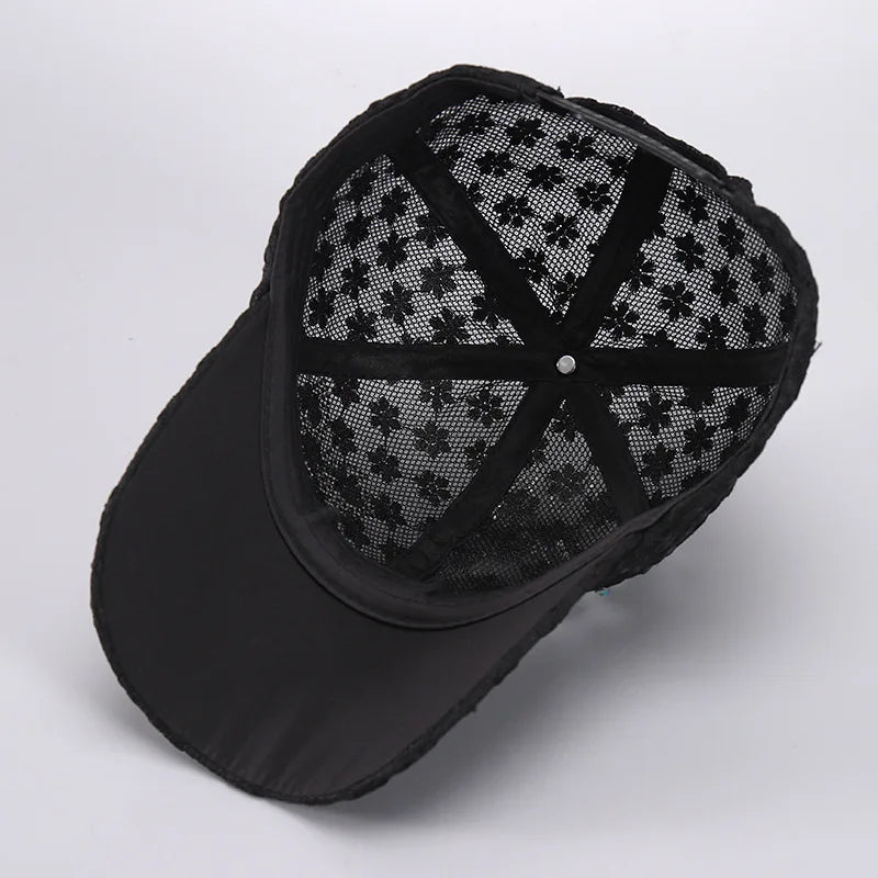 Black mesh snapback baseball cap with a floral pattern