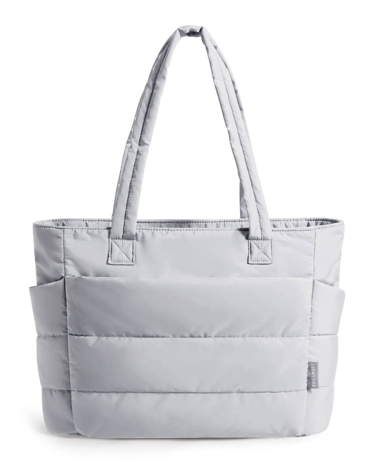 A light gray quilted tote bag with padded straps shown against a white background.