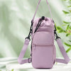 A light purple thermal water bottle bag with adjustable straps is shown against a bright green, leafy background.