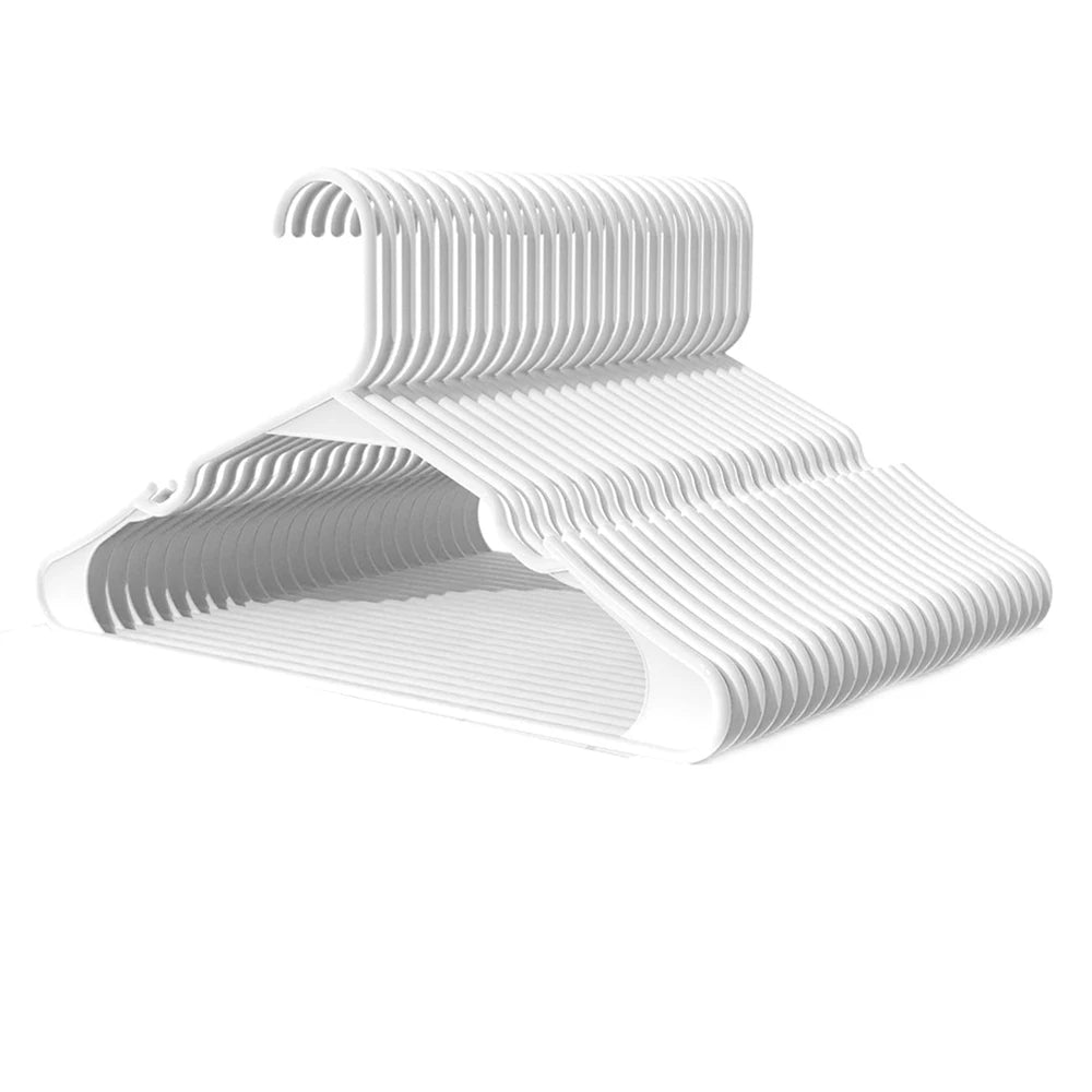 A white durable plastic non-slip clothing hanger with a curved hook design.