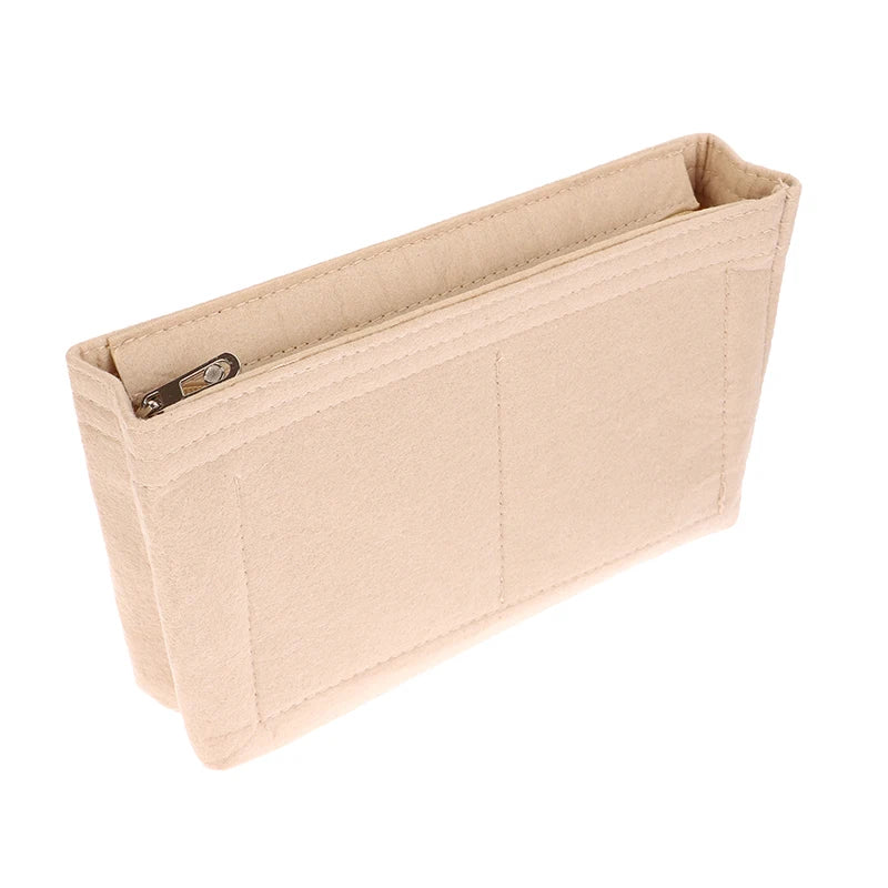 A light beige felt cosmetic bag insert organizer with a flap and a zipper closure.