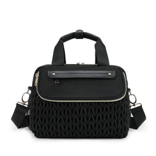 Black quilted mommy bag with a flap and crossbody strap for maternity or hospital use