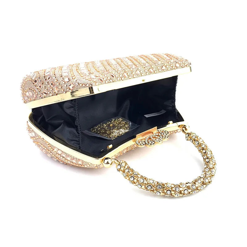 A gold-toned evening clutch bag embellished with clear crystals and featuring a delicate chain strap.