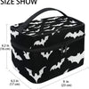 Bolsa portátil organizadora de maquillaje con temática de murciélago en blanco y negro, vista desde arriba.