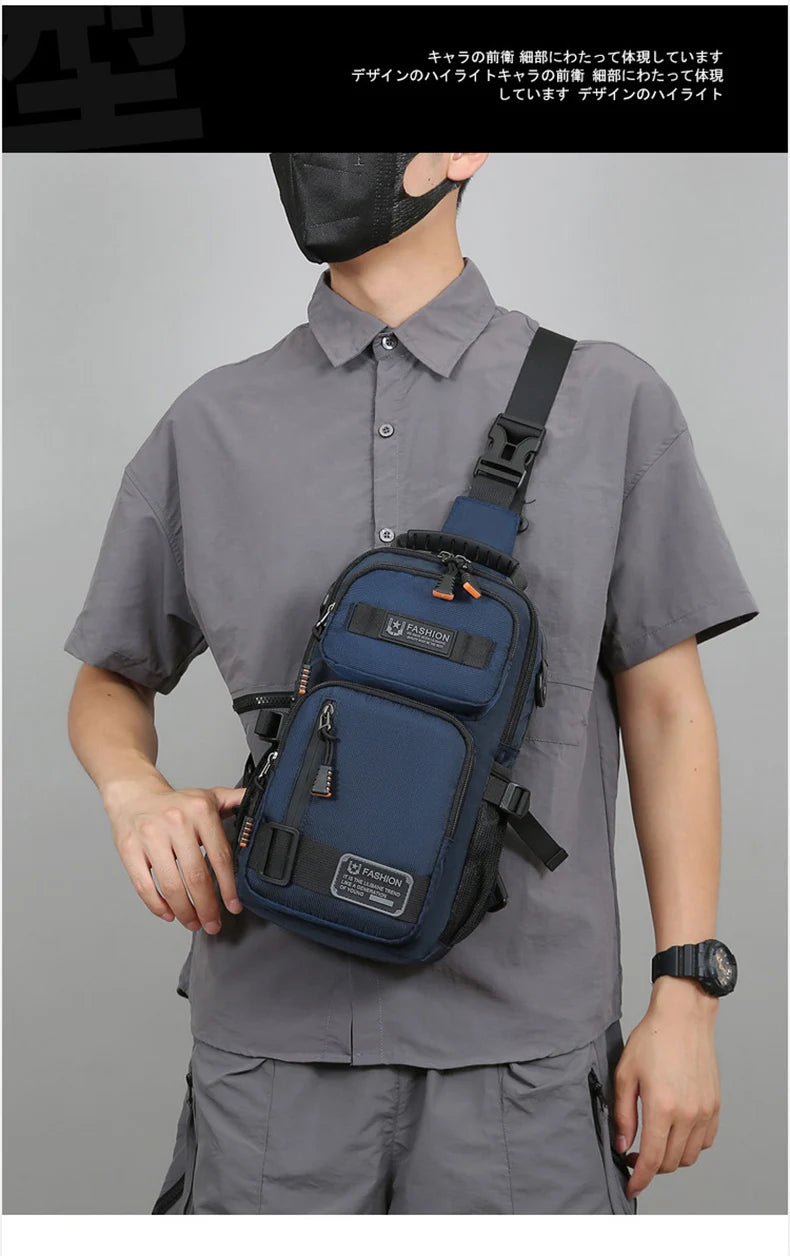 A man wearing a gray shirt holds a dark blue multifunctional chest bag for sports and hiking.