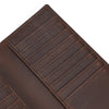 A close-up view of a brown genuine leather bi-fold wallet with stitched lines.