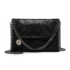 Black vintage flap crossbody bag with a silver chain strap.