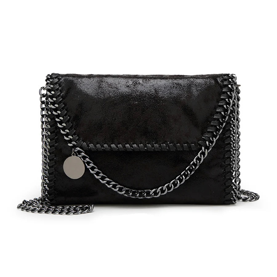 Black vintage flap crossbody bag with a silver chain strap.