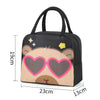 A black insulated lunch bag featuring a cartoon capybara face with pink heart-shaped sunglasses.