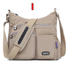 Beige wasserdichte Nylon-Crossbody-Tasche mit verstellbaren Riemen und mehreren Taschen.