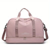 A light pink expandable nylon travel duffle bag with padded straps shown from the front.