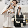 A young woman wearing a white t-shirt and headphones holds a black Kawaii Harajuku backpack with a laptop compartment.