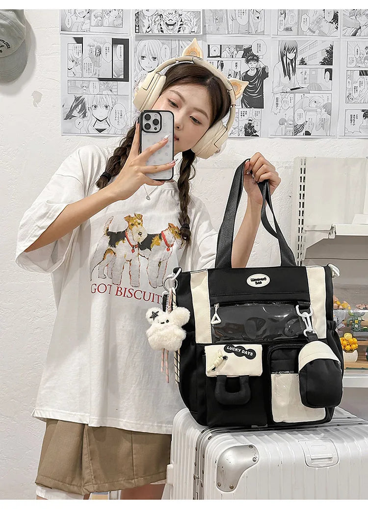 A young woman wearing a white t-shirt and headphones holds a black Kawaii Harajuku backpack with a laptop compartment.
