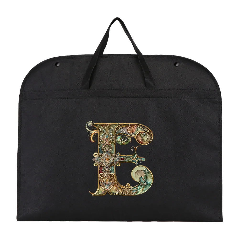 Black fabric dust cover and storage bag featuring a large, ornate gold letter E embroidered on the front.