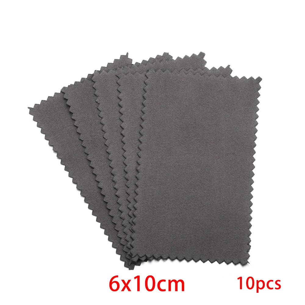 A stack of ten gray polishing cloths for silver and gold jewelry, measuring 6x10cm each.