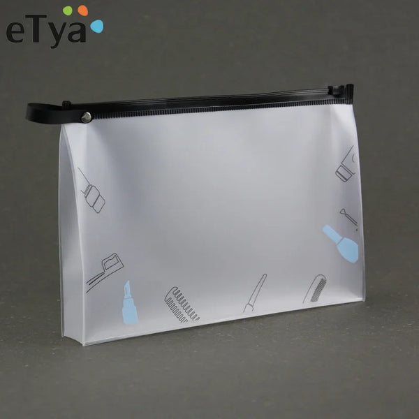 A transparent cosmetic storage bag with a black zipper and line drawings of various beauty products on the surface.