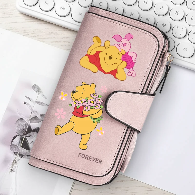 A pink women's long zipper handbag coin purse featuring cute yellow and pink bear illustrations.