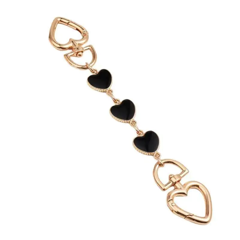 A delicate gold-toned moon-shaped bag chain strap with heart charms and an alloy clasp.