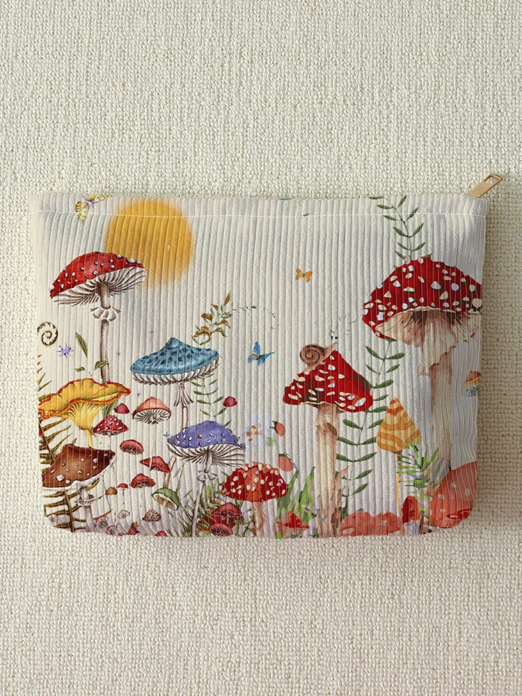 A fabric makeup bag featuring a watercolor print of various mushrooms and butterflies against a light background.