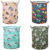 Une collection de quatre paniers à linge en tissu avec divers motifs et couleurs pour le rangement.