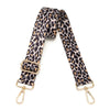 A black and tan leopard print nylon crossbody bag strap.