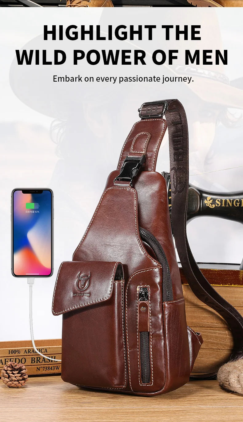 A brown genuine leather sling backpack for men is shown on a wooden surface.