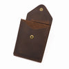A brown genuine cowhide leather wallet for men with brass rivets.