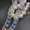Iridescent acrylic chunky chain strap featuring clear and iridescent links and round, glittery beads.