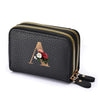 Black faux leather mini wallet with a gold letter A and floral design and a double zipper.