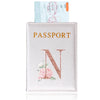 A light pink elegant PU travel passport holder featuring a gold embossed letter N and a pink rose design.