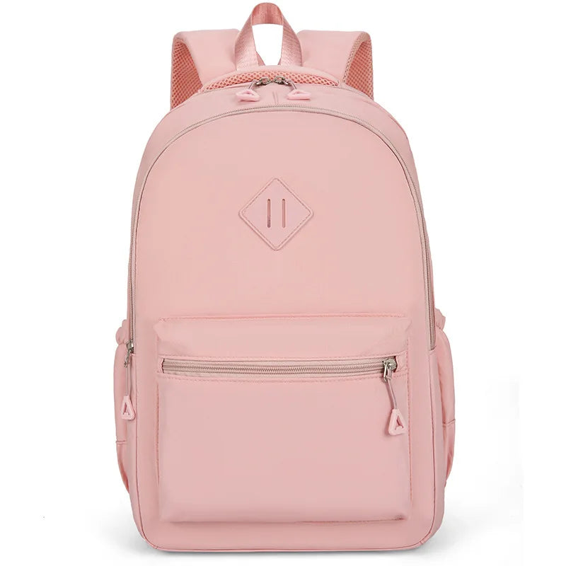 A pink durable nylon commuter backpack with a light pink fabric and gray accents.