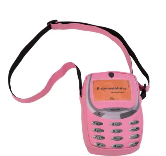 A pink vintage Y2K telephone backpack with a black strap and keypad.
