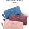 Three multipurpose women's leather wallets in blue, mauve, and pink stacked together