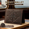 A dark brown leather short wallet with a compass design resting on a wooden surface.