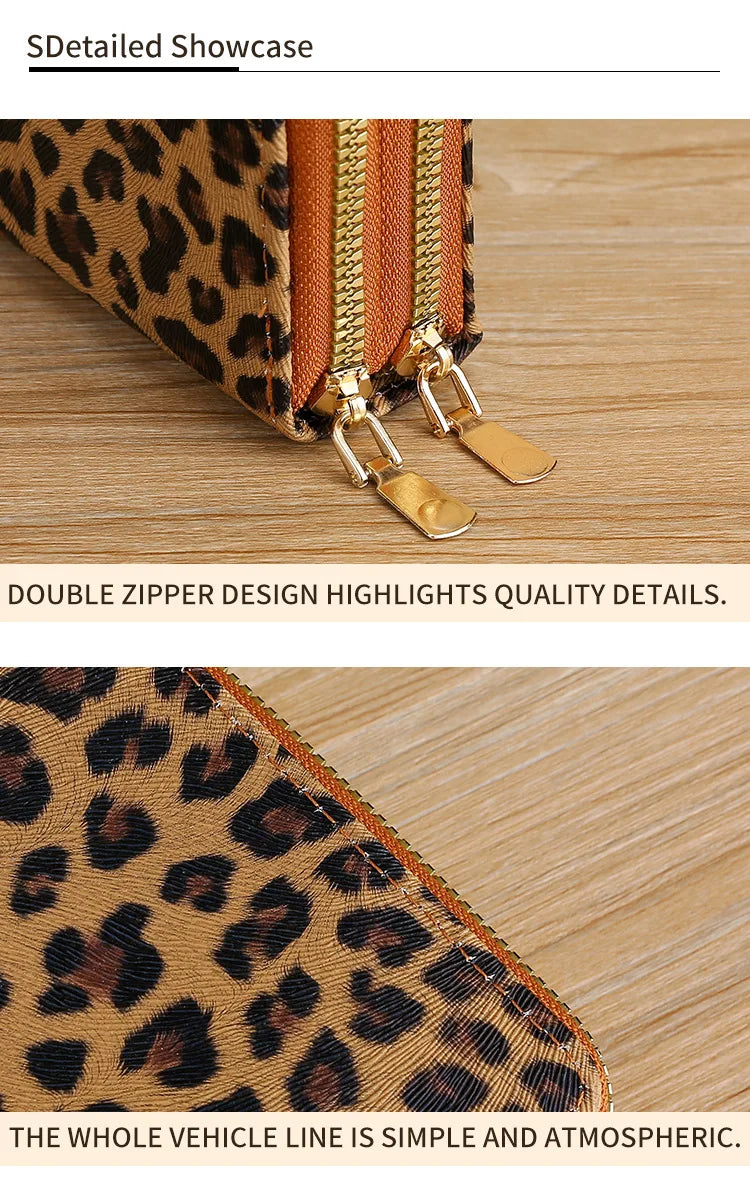 Close-up of a leopard print wallet featuring double zippers and gold hardware on a wooden surface.