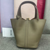 A beige classic genuine leather bucket bag displayed against a light gray background.