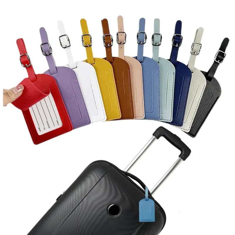 A set of colorful PU leather luggage tags with ID card holders arranged in a row.