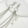 Silver punk star chain belt with pearl accents displayed on a white surface.